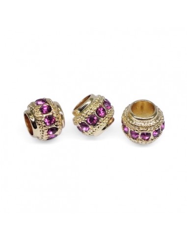Perla dorata con foro largo con strass fuxia...