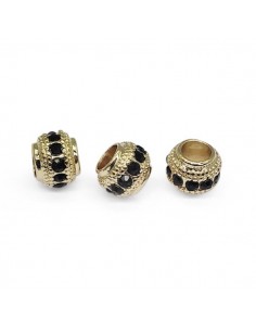 Perla dorata con foro largo con strass neri 6x7 mm, x 1