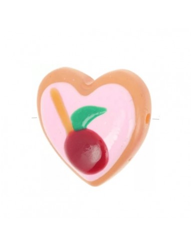 Perla in vetro cuore sfondo rosa con ciliegia...