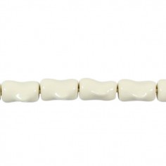 Perla in resina tubetto irregolare color bianco latte 20...