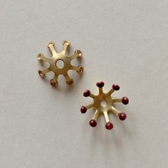 Charm fiore stilizzato  oro matt con punte smaltate...